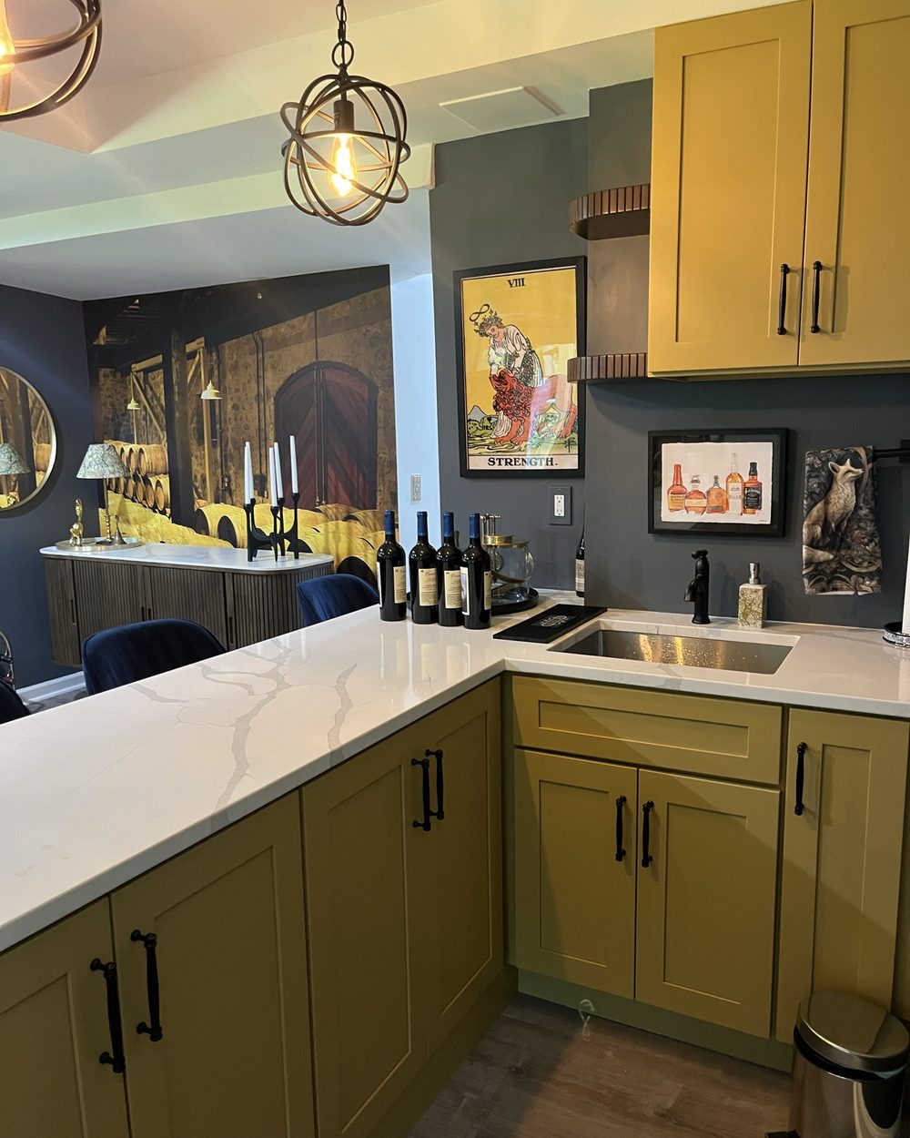 Home bar with mustard yellow cabinets and quartz counter