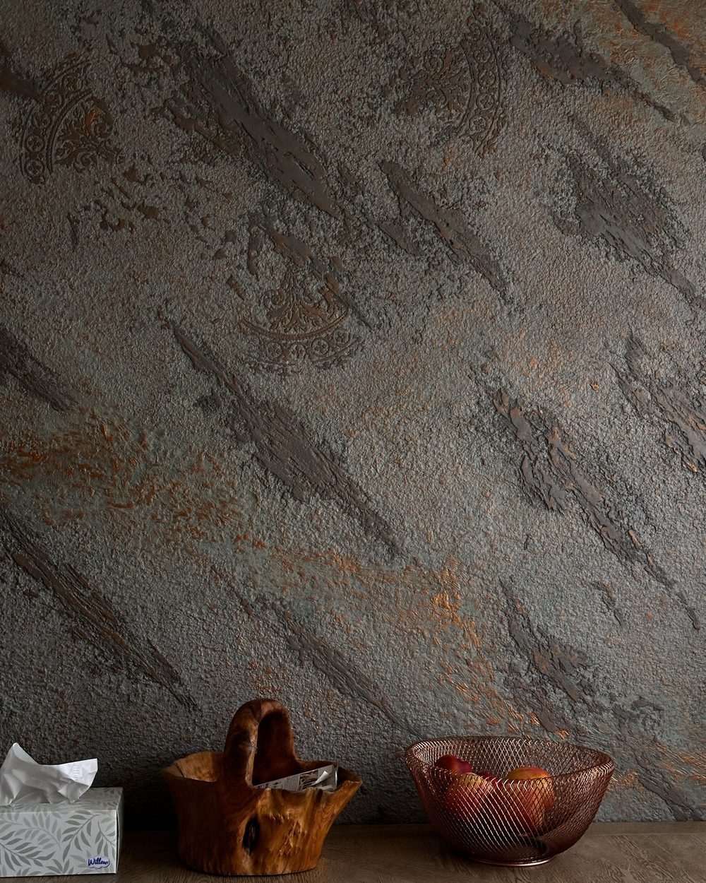 Metallic decorative plaster wall in gray and copper