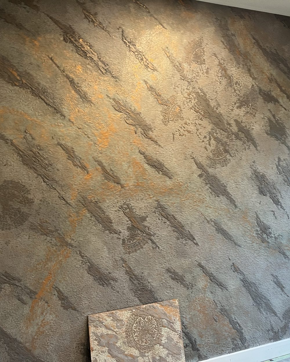 Wider view of the metallic plaster feature wall